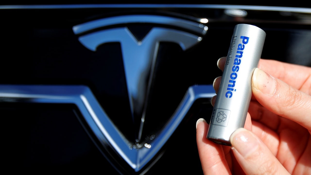 A Panasonic Corp's lithium-ion battery, which is part of Tesla Motor Inc's Model S and Model X battery packs, is pictured with the Tesla Motors logo during a photo opportunity at the Panasonic Center in Tokyo, Japan. Reuters
