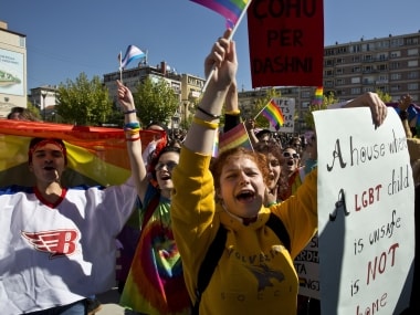 LGBT rights groups and supporters of the community hold banners during the Kosovo's first Gay Pride parade. AP