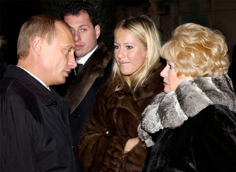 File image of Vladimir Putin with Ksenia Sobchak (centre) with her mother. AP