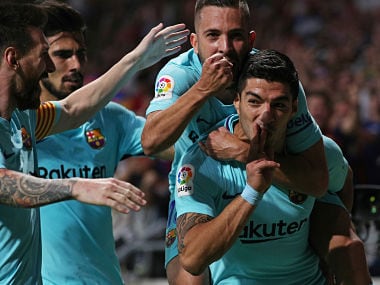 Barcelonas Luis Suarez celebrates scoring team's first goal with teammates. Reuters