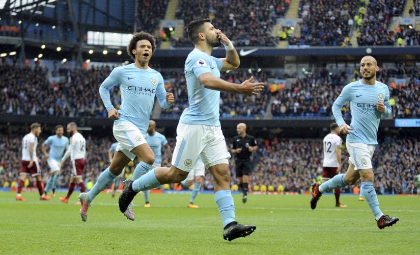 Manchester City's Sergio Aguero, centre, celebrates after scoring his side's first goal during their Premier League match against Burnley. AP