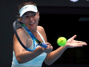 Maria Sharapova of Russia returns a shot against Ekaterina Makarova of Russia in women's singles match in China Open. AP