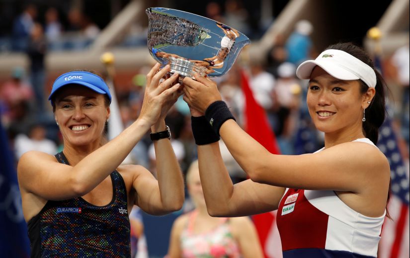 Martina Hingis and Yung-Jan Chan hold the ?US Open trophy after their win against Lucie Hradecka and Katerina Siniakova. This women's doubles title was the final Slam that Hingis own. Reuters
