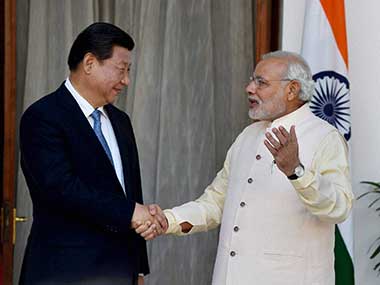 File image of Xi Jinping and Narendra Modi. PTI