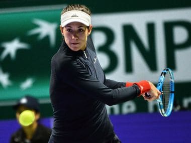 WTA Finals: Garbine Muguruza eases past erratic Jelena Ostapenko in straight sets