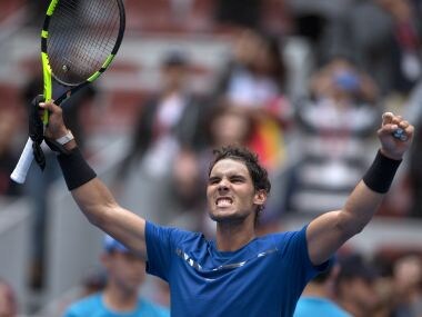 Rafael Nadal of Spain celebrates after defeating John Isner of the United States during a men's singles quarterfinal match of the China Open tennis tournament held at the Diamond Court in Beijing, China, Friday, Oct. 6, 2017. (AP Photo/Ng Han Guan)