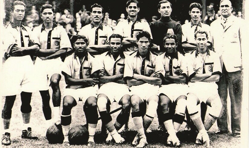 ‘Barefoot Wonders’: The Indian team at the 1948 London Olympics. (Standing, L to R) K.P. Dhanraj, Mahabir Prasad, S.A. Basheer, Sunil Nandy, K.V. Varadaraj (goalkeeper), T.M. Verghese ‘Papen’ and trainer-coach Balai Das Chatterjee. (Sitting, L to R) S. Mewalal, Ahmed Khan, Talimeran Ao (captain), S.V. Raman (India’s goalscorer) and Sailen Manna.