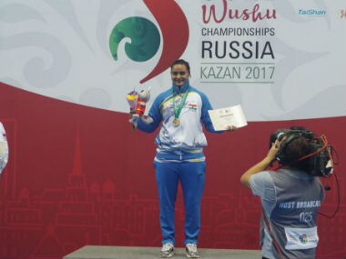 Pooja Kadian poses after winning gold medal at the Wushu World Championship. Twitter: @CRPF