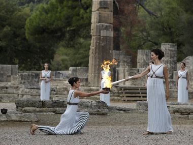 Pyeongchang Winter Olympics 2018 torch lit in Ancient Olympia despite rain disruption