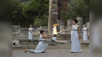 Pyeongchang Winter Olympics 2018 torch lit in Ancient Olympia despite rain disruption