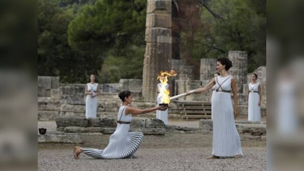 Pyeongchang Winter Olympics 2018 torch lit in Ancient Olympia despite rain disruption