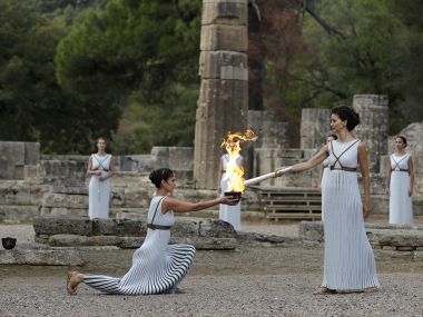 Pyeongchang Winter Olympics 2018 torch lit in Ancient Olympia despite rain disruption Pyeongchang Winter Olympics 2018 torch lit in Ancient Olympia despite rain disruption
