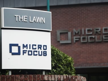 Signs stand outside the offices of Micro Focus. Reuters