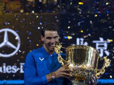 Rafael Nadal of Spain poses with this trophy after defeating Nick Kyrgios of Australia in the men's singles final match in the China Open tennis tournament at the Diamond Court in Beijing, China, Sunday, Oct. 8, 2017. (AP Photo/Ng Han Guan)
