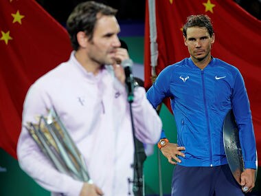 Roger Federer of Switzerland and Rafael Nadal of Spain after the match. Reuters