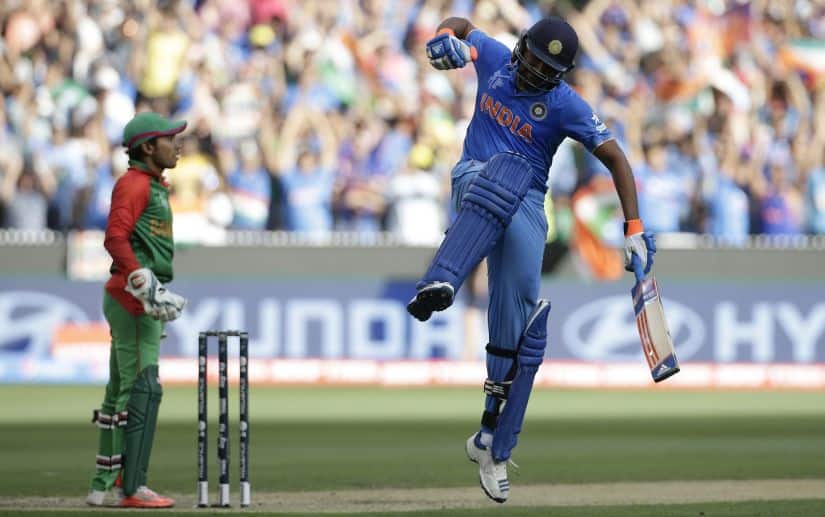 File photo of Rohit Sharma celebrating after reaching his century during the World Cup quarter-final match against Bangladesh. Reuters 