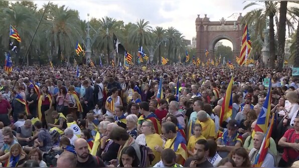 Catalan president, leaders sign declaration of independence but put it on hold for talks with Madrid