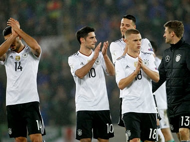 Germany's, from left, Emre Can, Lars Stindl, Joshua Kimmich and Thomas Mueller applaud their supporters after the World Cup Group C qualifying soccer match between Northern Ireland and Germany at Windsor Park in Belfast, Northern Ireland, Thursday, Oct. 5, 2017. (AP Photo/Peter Morrison)