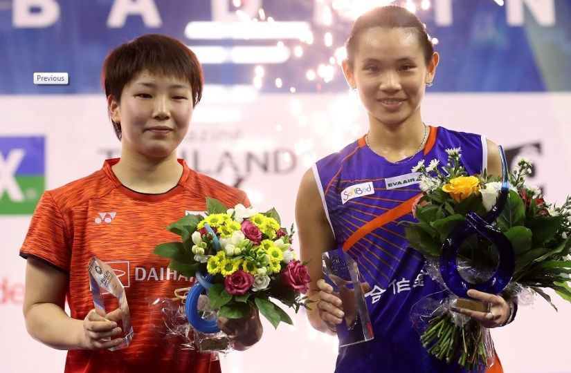 Tai Tzu-ying (R) and Akane Yamaguchi pose for photos after Tai beat Yamaguchi 21-4, 21-16 in the women's singles final at the French Open Superseries. Getty