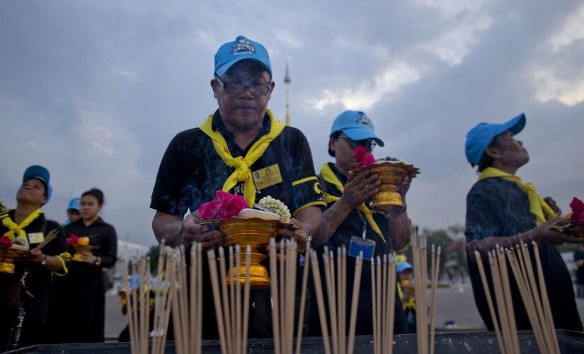 Mourners at the funeral site of Thailand's late King Bhumibol Adulyadej . AP