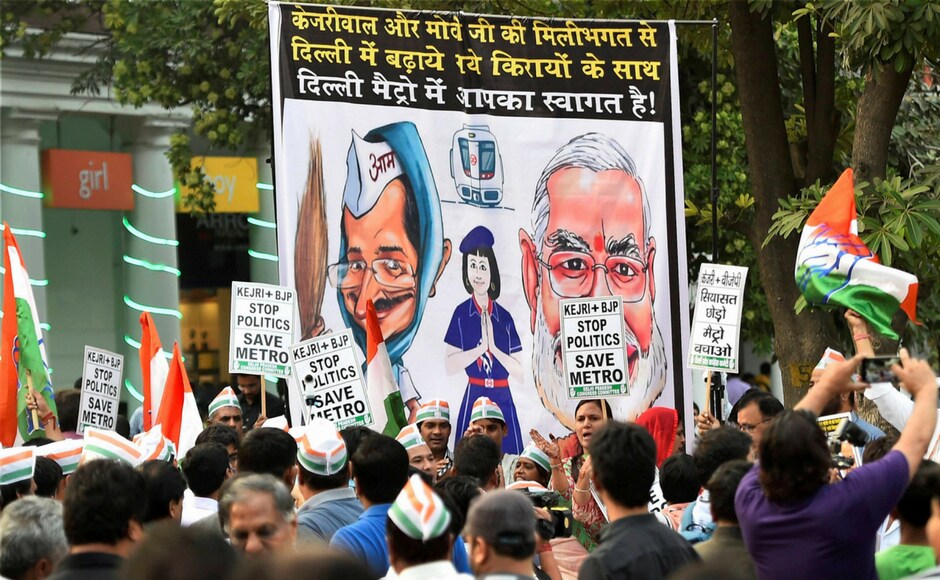 Delhi Congress workers during the launch of their week-long " Kejriwal+BJP, Stop Politics, Save Metro" campaign at Rajiv Chowk Metro Station in New Delhi on Wednesday. PTI
