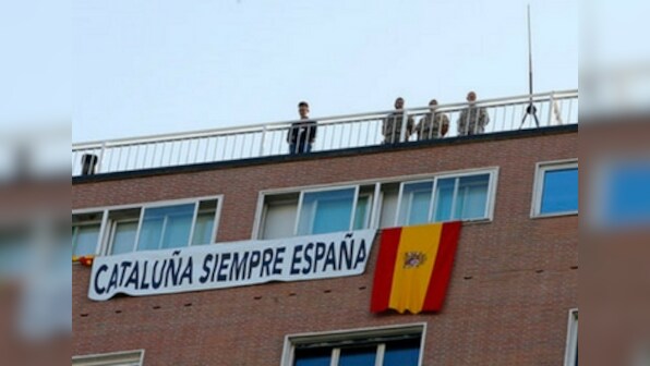 Spain celebrates national day with show of unity as Catalan crisis rages on