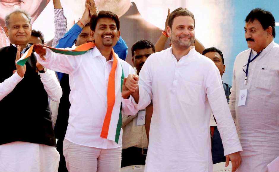 Congress vice-president Rahul Gandhi with the OBC leader Alpesh Thakor who joined the party, during a public meeting in Gandhinagar, Gujarat on Monday. PTI Congress vice-president Rahul Gandhi with the OBC leader Alpesh Thakor who joined the party, during a public meeting in Gandhinagar, Gujarat on Monday. PTI
