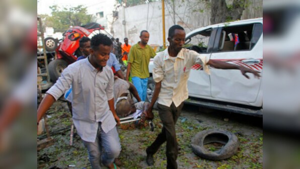 Suicide car bomb explosion kills 13, injures 16 in Somalian capital; gunfire heard inside Mogadishu hotel, say police
