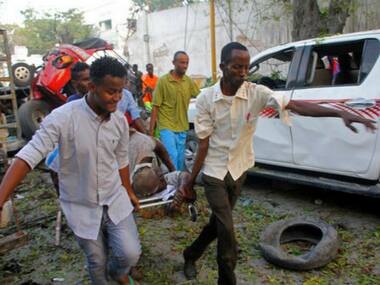 Suicide car bomb explosion kills 13, injures 16 in Somalian capital; gunfire heard inside Mogadishu hotel, say police