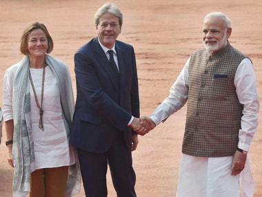 Prime Minister Narendra Modi welcomes his Italian counterpart Paolo Gentiloni and his wife Emanuela Mauro during a ceremonial reception at the Rashtrapati Bhawan. PTI