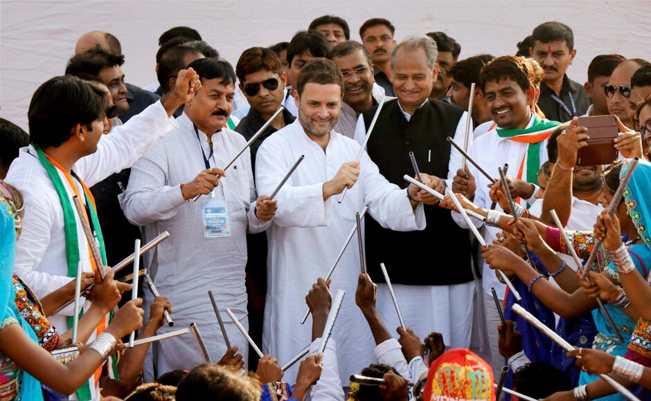 Rahul Gandhi take part in a cultural dance during a public meeting in Gandhinagar, Gujarat on Monday. Party leaders Ashok Gehlot and Bharatsinh Solanki also in frame. PTI Rahul Gandhi take part in a cultural dance during a public meeting in Gandhinagar, Gujarat on Monday. Party leaders Ashok Gehlot and Bharatsinh Solanki also in frame. PTI