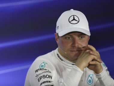 Mercedes driver Valtteri Bottas of Finland listens during a press conference after winning the Singapore Formula One Grand Prix on the Marina Bay City Circuit Singapore, Sunday, Sept. 17, 2017. (AP Photo/Yong Teck Lim)