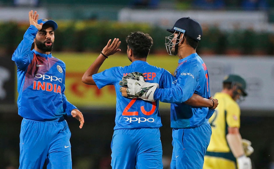 India captain Virat Kohli and wicketkeeper MS Dhoni congratulate Kuldeep Yadav, after he outwitted Aaron Finch and castled him. AP India captain Virat Kohli and wicketkeeper MS Dhoni congratulate Kuldeep Yadav, after he outwitted Aaron Finch and castled him. AP