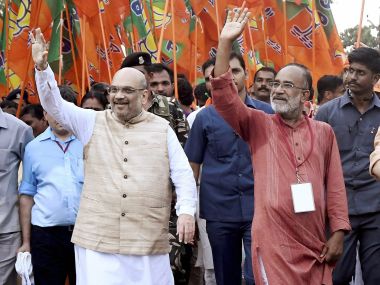BJP national president Amit Shah and tourism minister Alphonse Kannanthanam at Payyannur in Kannur on Tuesday. PTI