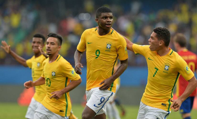 Brazil’s Lincoln (C) celebrates his goal against Spain with teammates during a group stage match in the FIFA U-17 World Cup in Kochi. AFP 