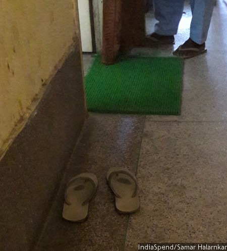 Litigants, almost all poor Muslims, must leave their footwear outside a court room in the Ullubari foreigners tribunal in Guwahati, Assam. Lawyers and court officers can keep footwear on. IndiaSpend
