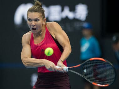 Simona Halep hits a return during her women's singles match against Maria Sharapova at the China Open. AFP