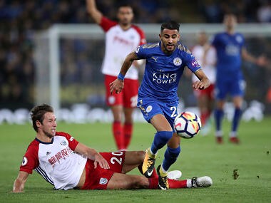Leicester City's Riyad Mahrez is challenged by West Bromwich Albion's Grzegorz Krychowiak, left, during the English Premier League soccer match at the King Power Stadium, Leicester, England, Monday, Oct. 16, 2017. (Nick Potts/PA via AP)