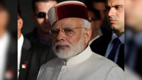 As BJP-Congress battle heats up in Himachal Pradesh, people flaunt their political 'colours' on their headgear