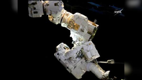 NASA astronauts conduct a seven hour long spacewalk to install a new external camera system