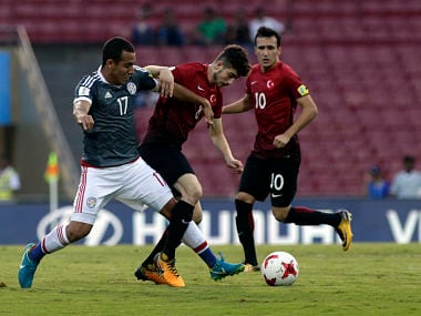 Turkey's player Egehan Gok duels for the ball against Paraguay's Stevens Gomez during the FIFA U-17 World Cup match in Mumbai. AP