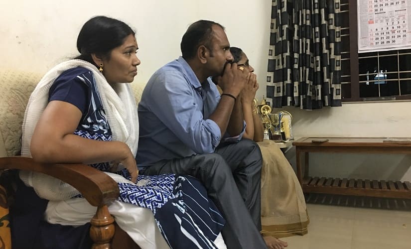 Rahul’s parents Bindu and Praveen watch the game nervously on Monday. Image courtesy: Amit Kamath