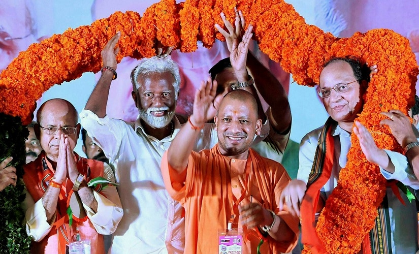 Uttar Pradesh chief minister Yogi Adityanath, BJP state president Kummanam Rajasekharan and other national leaders being felicitated at a public meeting as part of ‘Janaraksha Yathra’ in Kannur. PTI