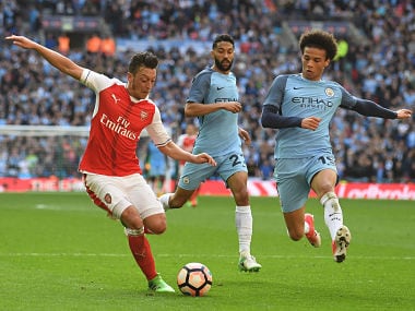 Arsenal's German midfielder Mesut Ozil (L) vies with Manchester City's German midfielder Leroy Sane (R) during the FA Cup semi-final football match between Arsenal and Manchester City at Wembley stadium in London on April 23, 2017. / AFP PHOTO / Justin TALLIS / NOT FOR MARKETING OR ADVERTISING USE / RESTRICTED TO EDITORIAL USE