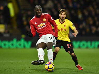 Manchester United's Belgian striker Romelu Lukaku (L) plays the ball away from Watford's Spanish defender Kiko Femenia (R) during the English Premier League football match between Watford and Manchester United at Vicarage Road Stadium in Watford, north of London on November 28, 2017. / AFP PHOTO / Glyn KIRK / RESTRICTED TO EDITORIAL USE. No use with unauthorized audio, video, data, fixture lists, club/league logos or 'live' services. Online in-match use limited to 75 images, no video emulation. No use in betting, games or single club/league/player publications. /