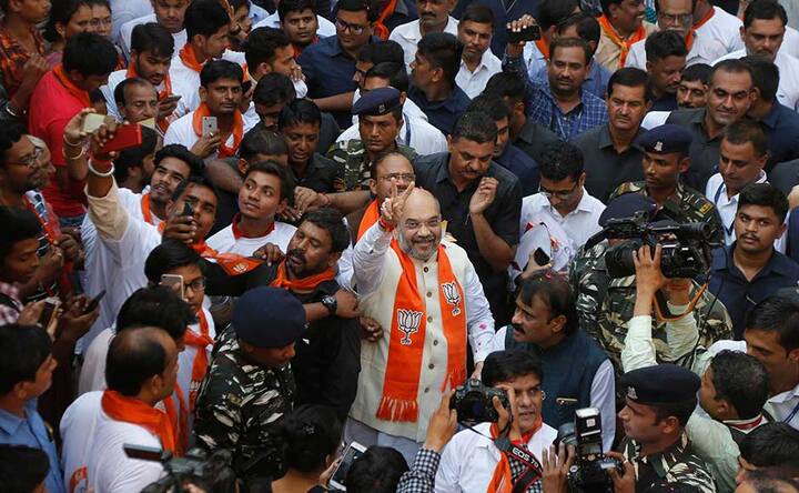 Amit Shah kicks off six-day Gujarat campaign: BJP chief takes Modi's 'message of development' to voters' doors Amit Shah kicks off six-day Gujarat campaign: BJP chief takes Modi's 'message of development' to voters' doors