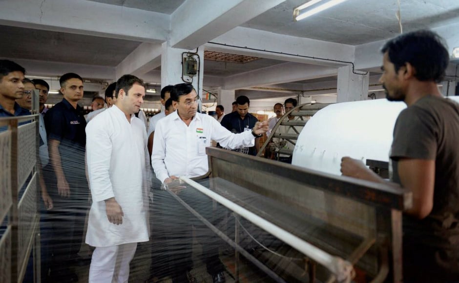 Rahul Gandhi visited workers and industry representatives of a textile factory in Surat on Wednesday in poll-bound Gujarat. PTI Rahul Gandhi visited workers and industry representatives of a textile factory in Surat on Wednesday in poll-bound Gujarat. PTI