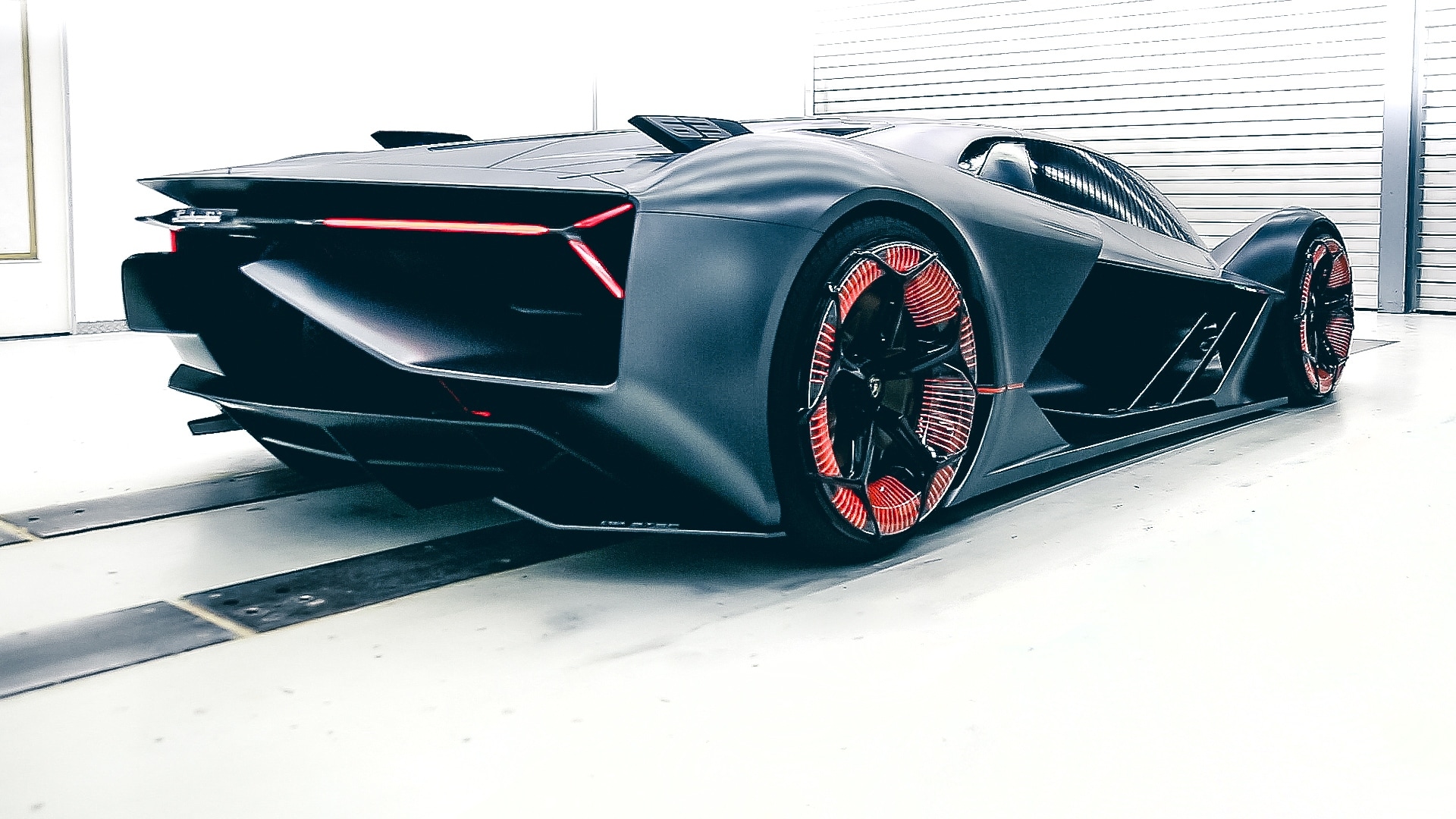 The Terzo Millenio’s virtual cockpit has a Piloted Driving simulation which takes the driver on a virtual track by a virtual expert. Image Credits Lamborghini The Terzo Millenio’s virtual cockpit has a Piloted Driving simulation which takes the driver on a virtual track by a virtual expert. Image Credits Lamborghini
