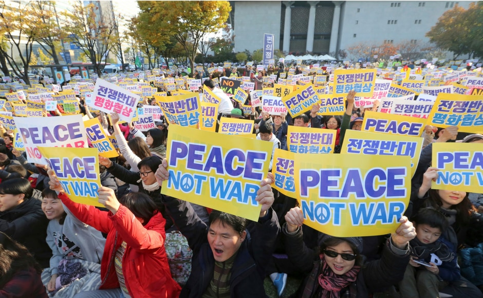This shows the widening gap in the Korean society where some believe that only peace can resolve the conflict while others are open to considering the military option. AP This shows the widening gap in the Korean society where some believe that only peace can resolve the conflict while others are open to considering the military option. AP