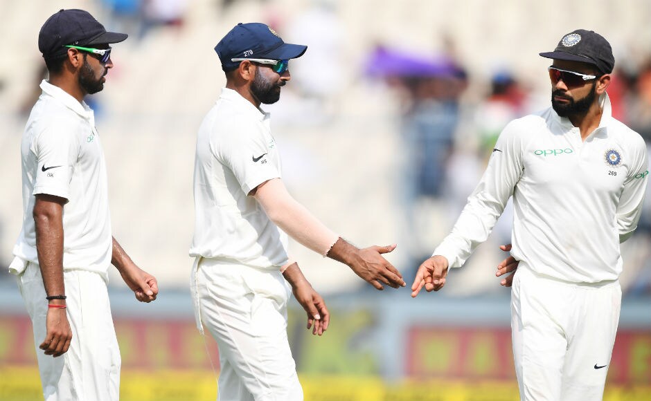 Both Bhuvneshwar Kumar and Mohammed Shami ended with four wickets each as Sri Lanka took a 122-run lead. Here, captain Kohli congratulates both the pacers after they wrapped Lanka's innings. AFP Both Bhuvneshwar Kumar and Mohammed Shami ended with four wickets each as Sri Lanka took a 122-run lead. Here, captain Kohli congratulates both the pacers after they wrapped Lanka's innings. AFP